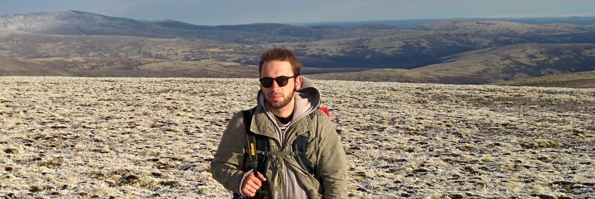 Pavel Fedorov during geological fieldwork in a mountain landscape